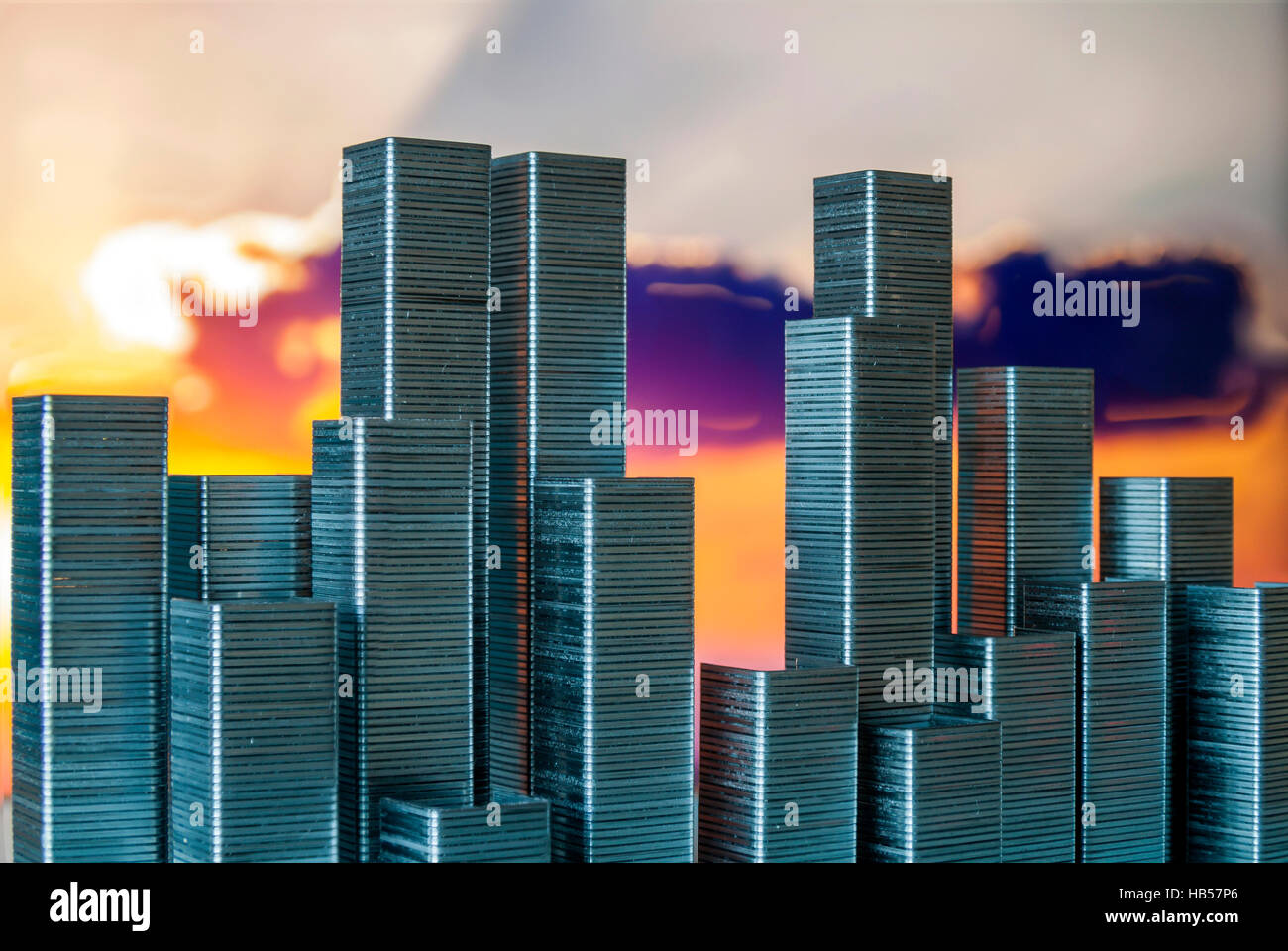 Staples arranged to form city skyline on a sunset background Stock