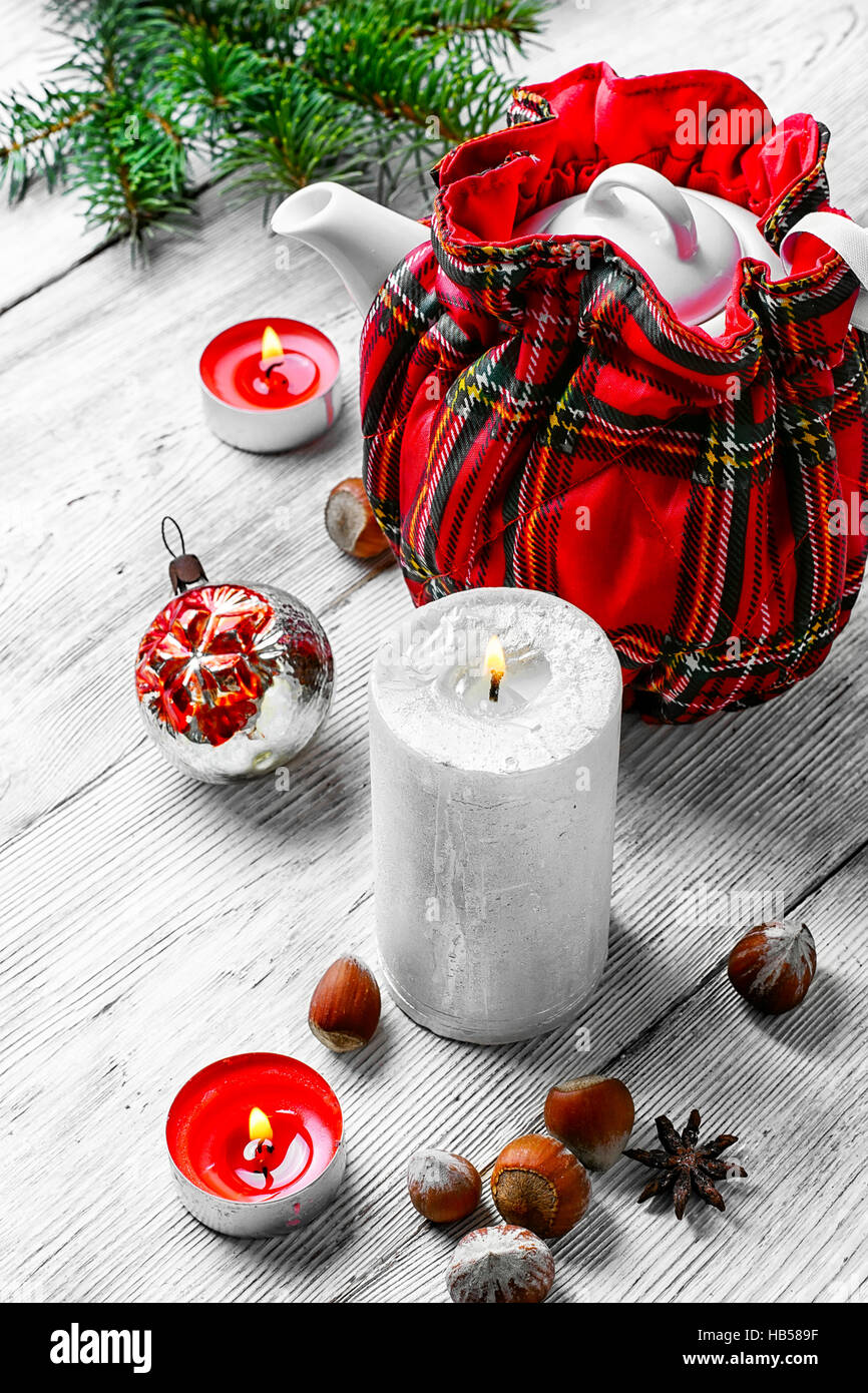 Kettle in stylish tea warmer Christmas background Stock Photo