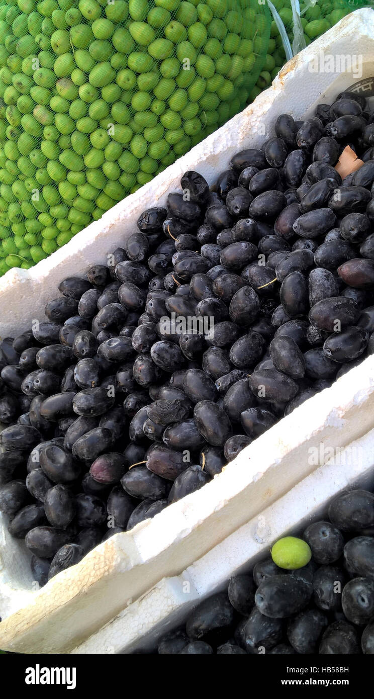 Olives for sale in the Fruit and Vegetable Souk, Madaba, Jordan. The Olives are tightly packed