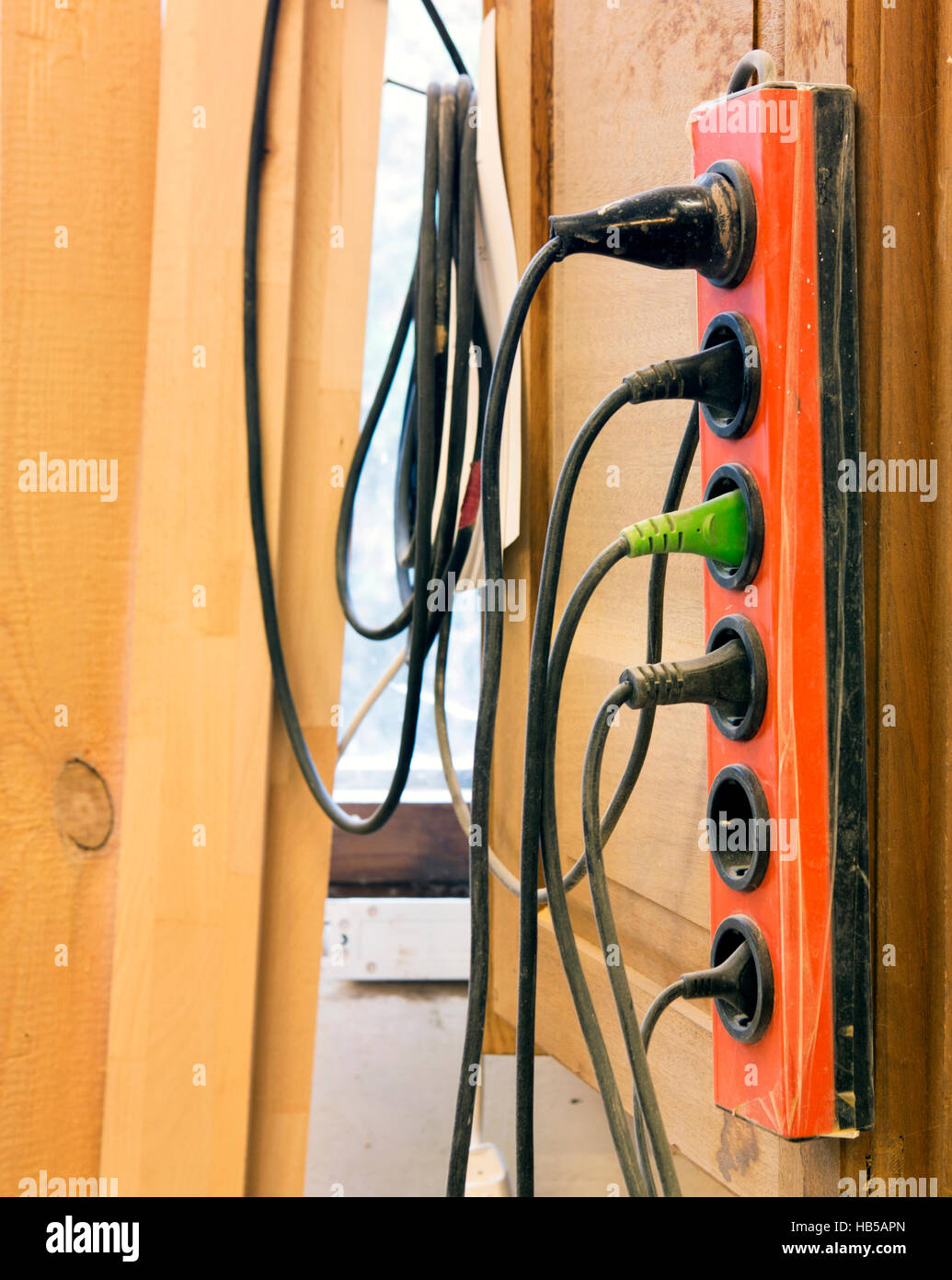old sockets with a bunch of cables hanging on wall Stock Photo Alamy