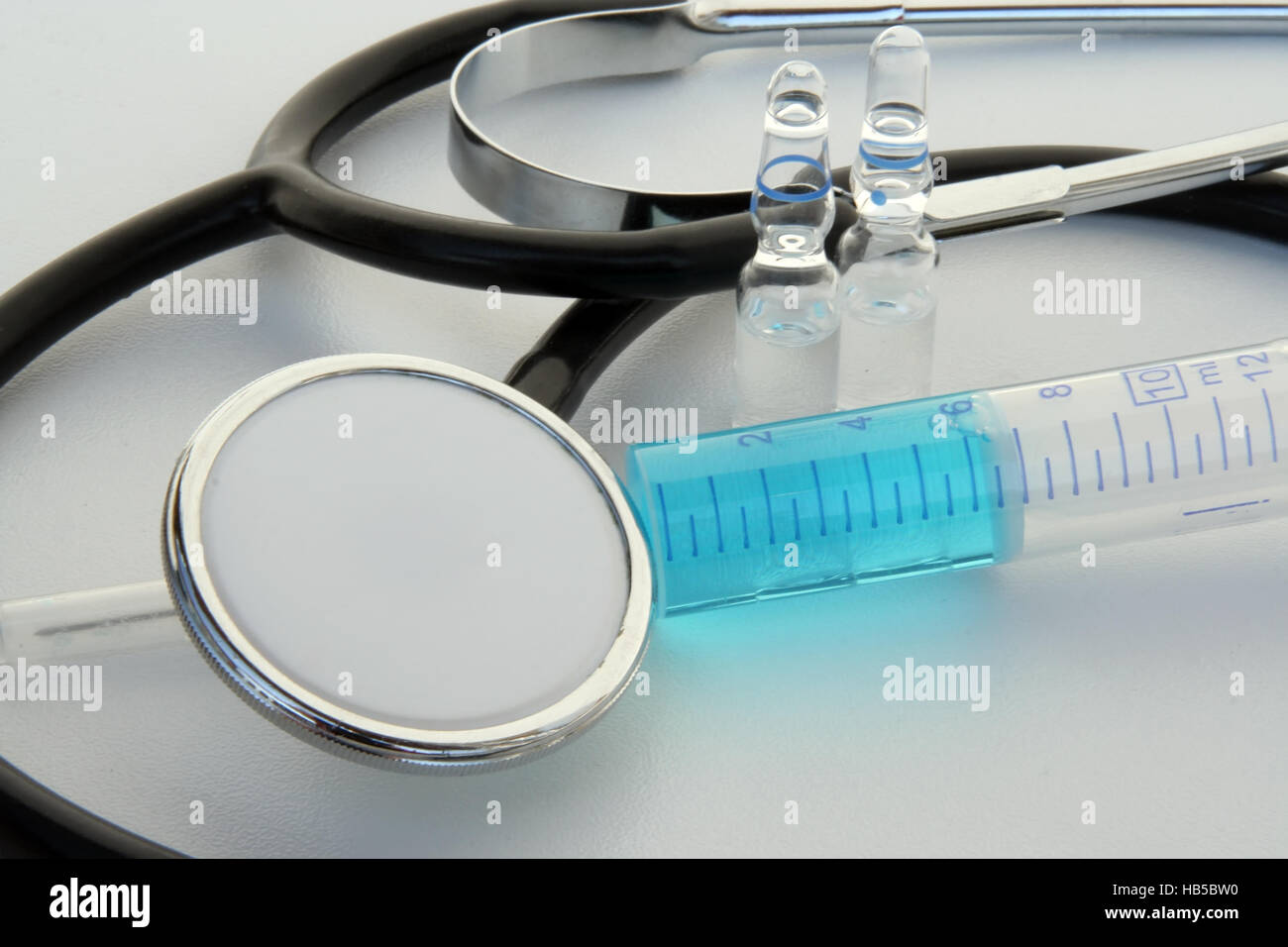 Medical tools. Medical stethoscope and syringe. Stock Photo
