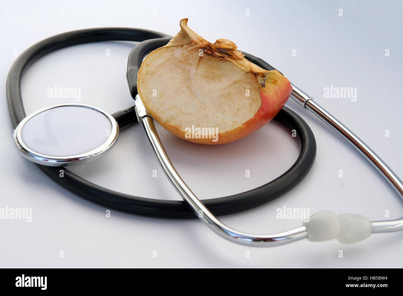 Medical tools. Medical stethoscope and a apple. Stock Photo