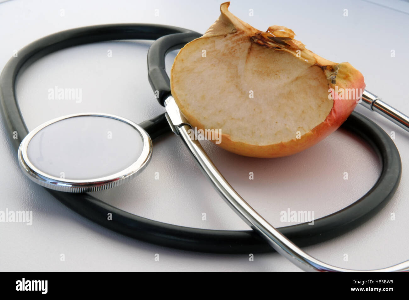 Medical tools. Medical stethoscope and a apple. Stock Photo