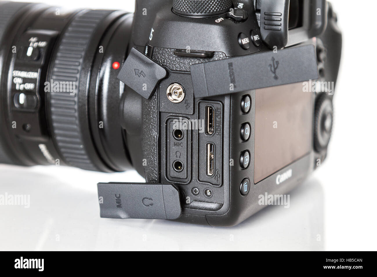 Canon 5D Mark IV camera showing conectors, with Canon EF 24-70mm f/2.8L II USM lens on a white background Stock Photo