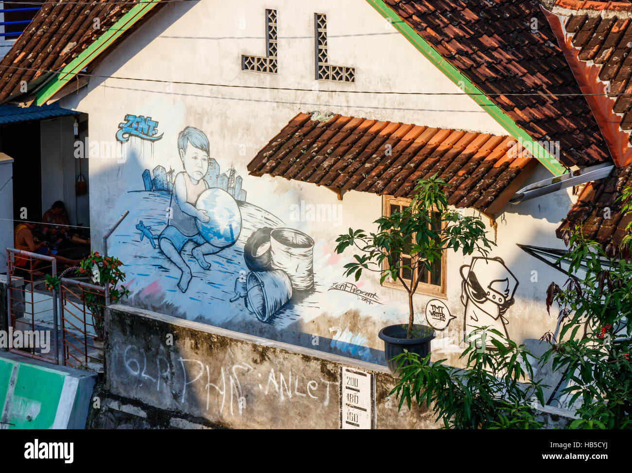 Street art on the wall of a house in Yogyakarta. The street art in ...