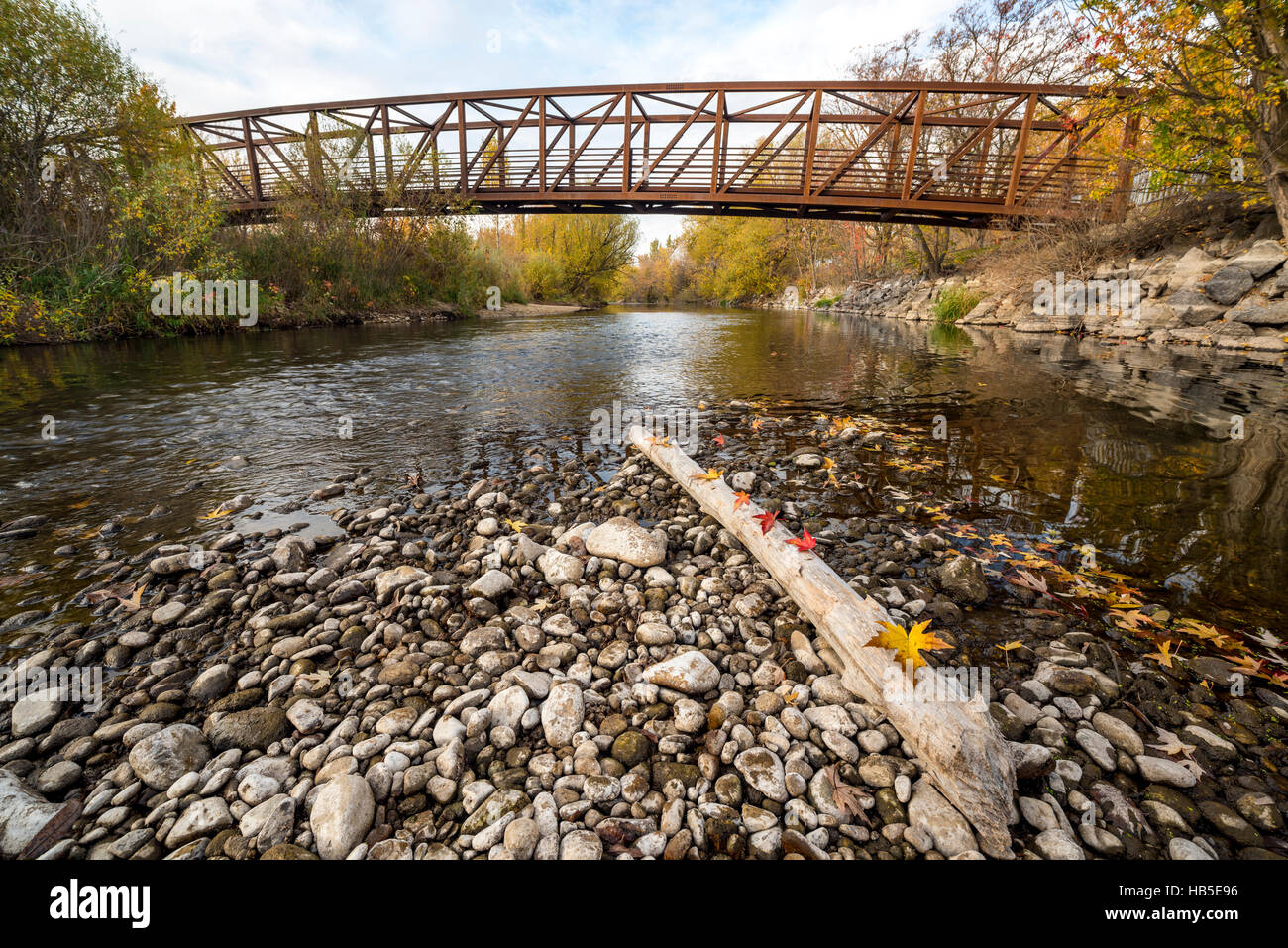 Footbridge over the Boise river with fall color Stock Photo