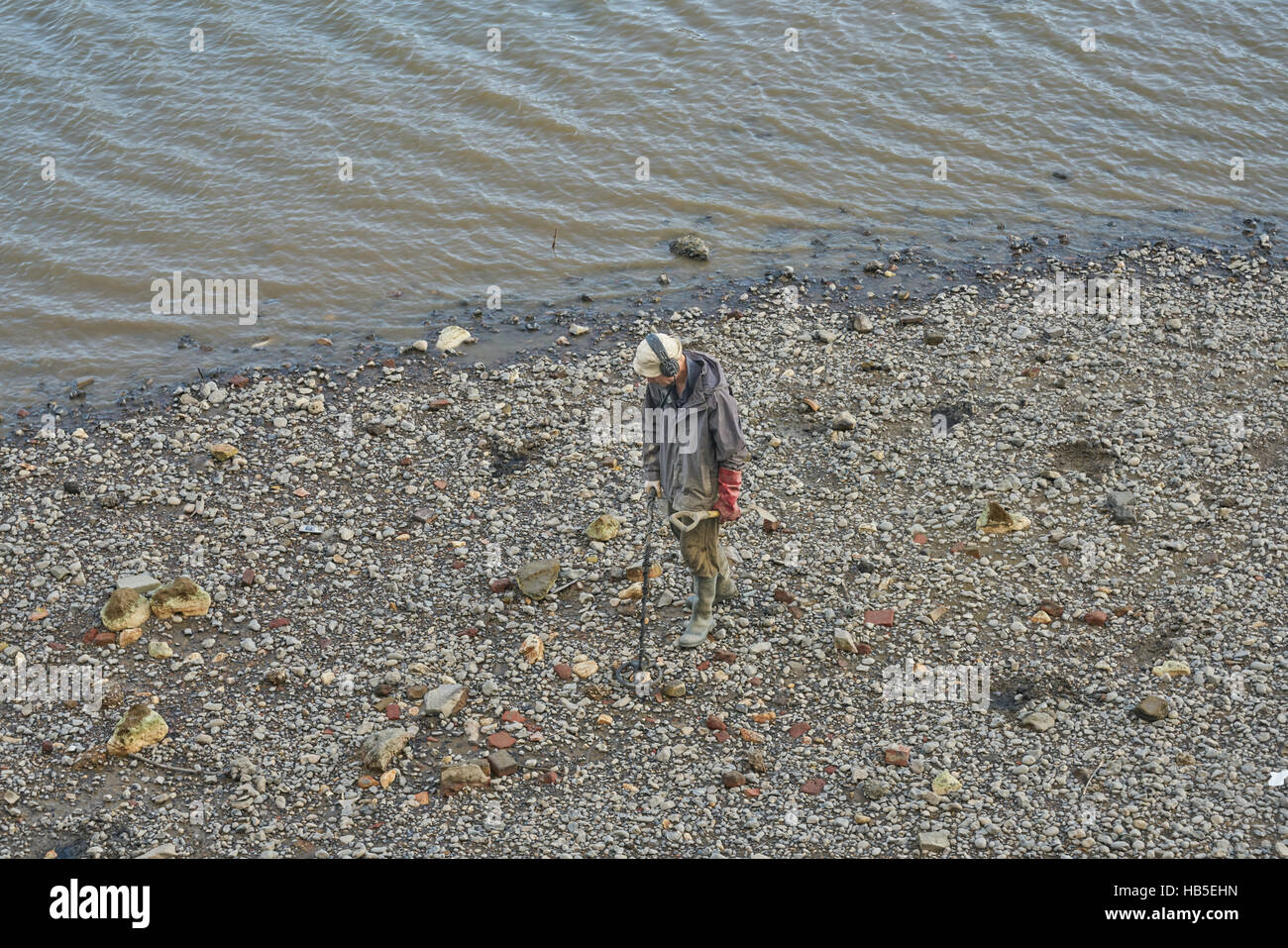 metal detectoring on river. Metal detector. Thames Mudlarking Stock
