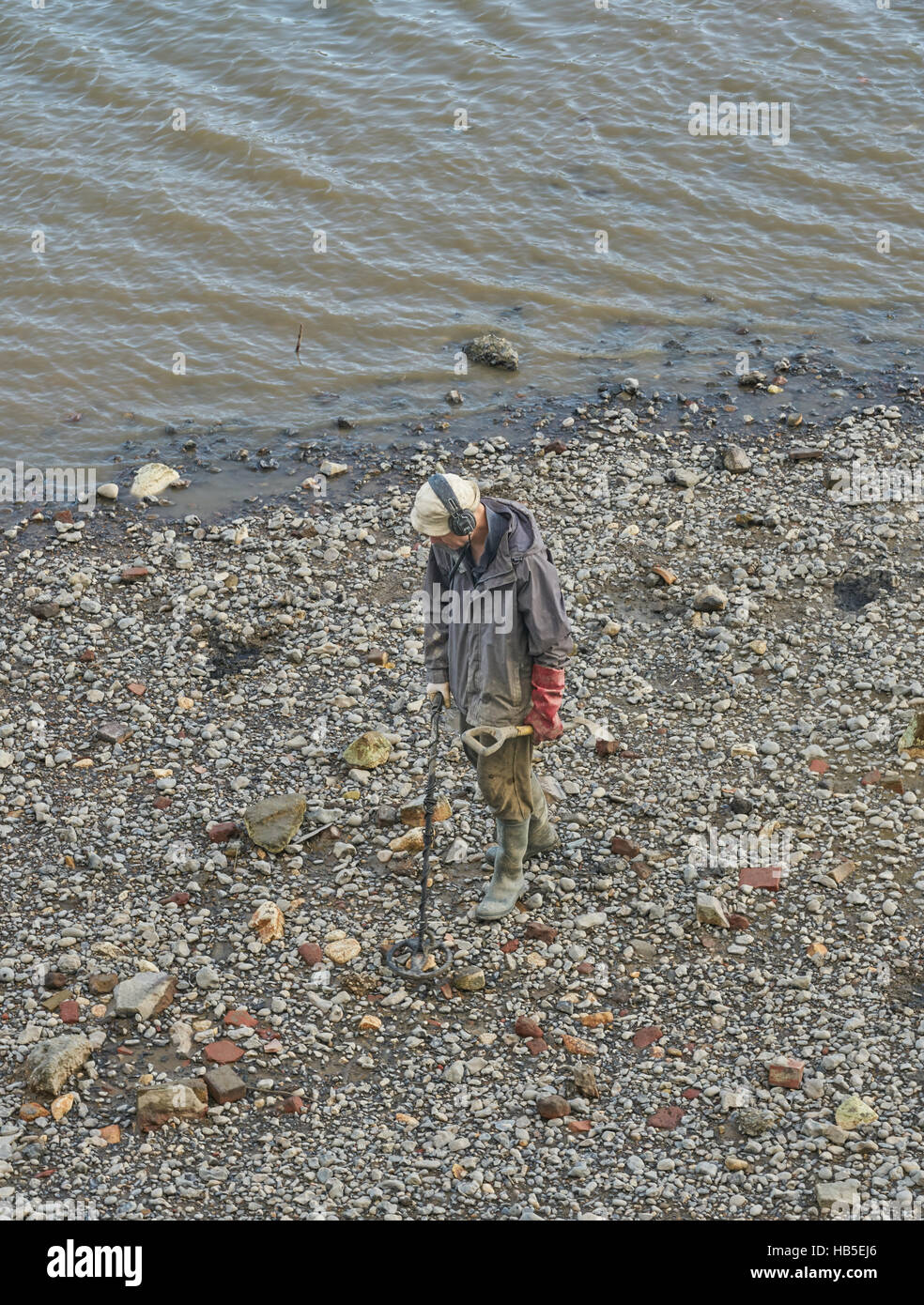 metal detectoring on river. Metal detector. Thames Mudlarking Stock