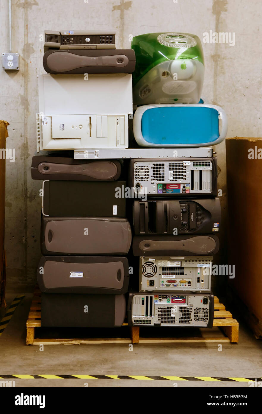 Donated PC and Apple hard drives sit at a Goodwill store in Austin, Texas waiting to be recycled. Stock Photo