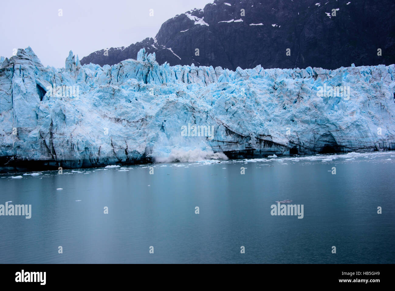 Glacier calving in glacier bay Stock Photo