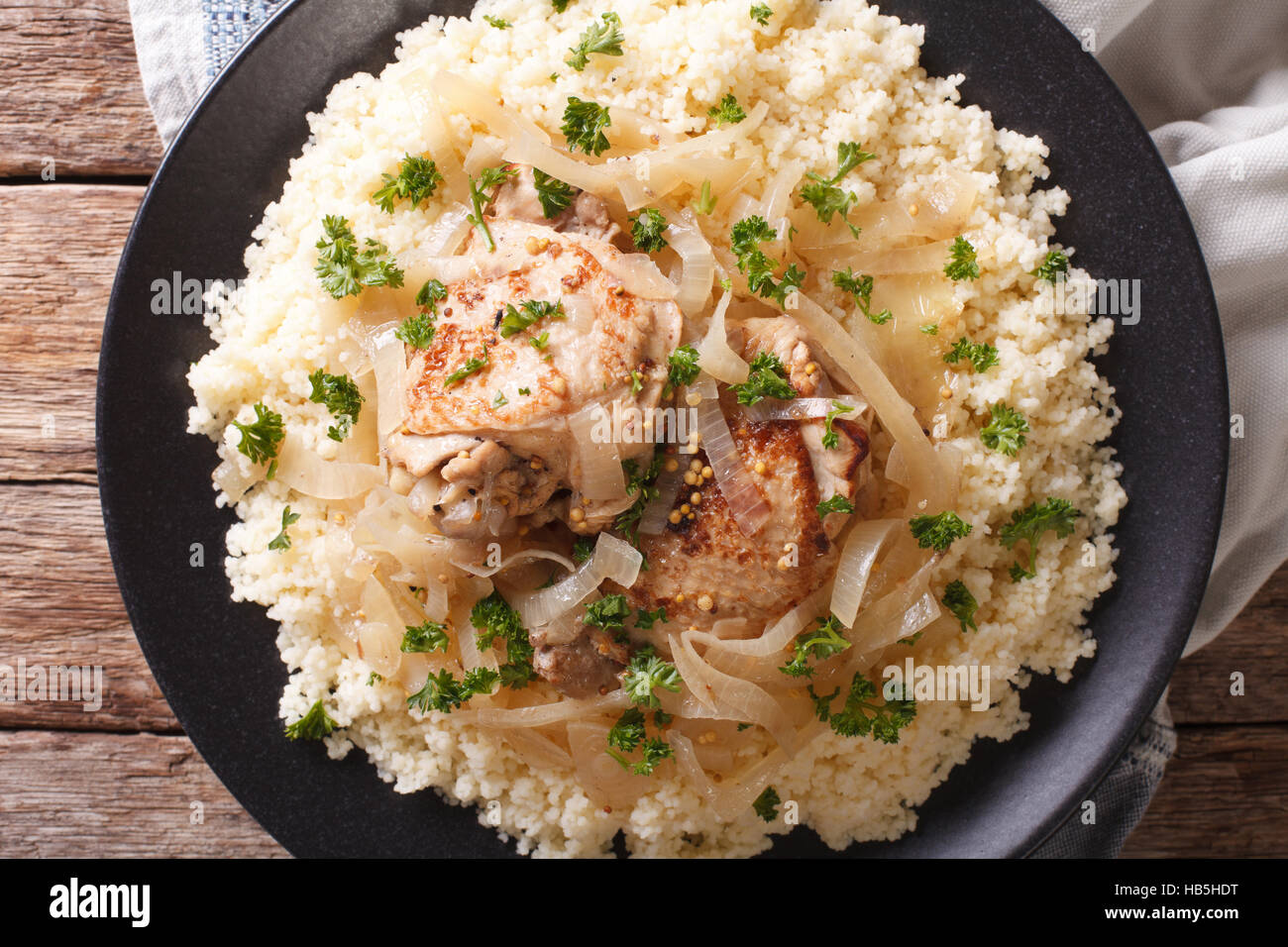 Traditional Senegalese cuisine Chicken Yassa with couscous and onions