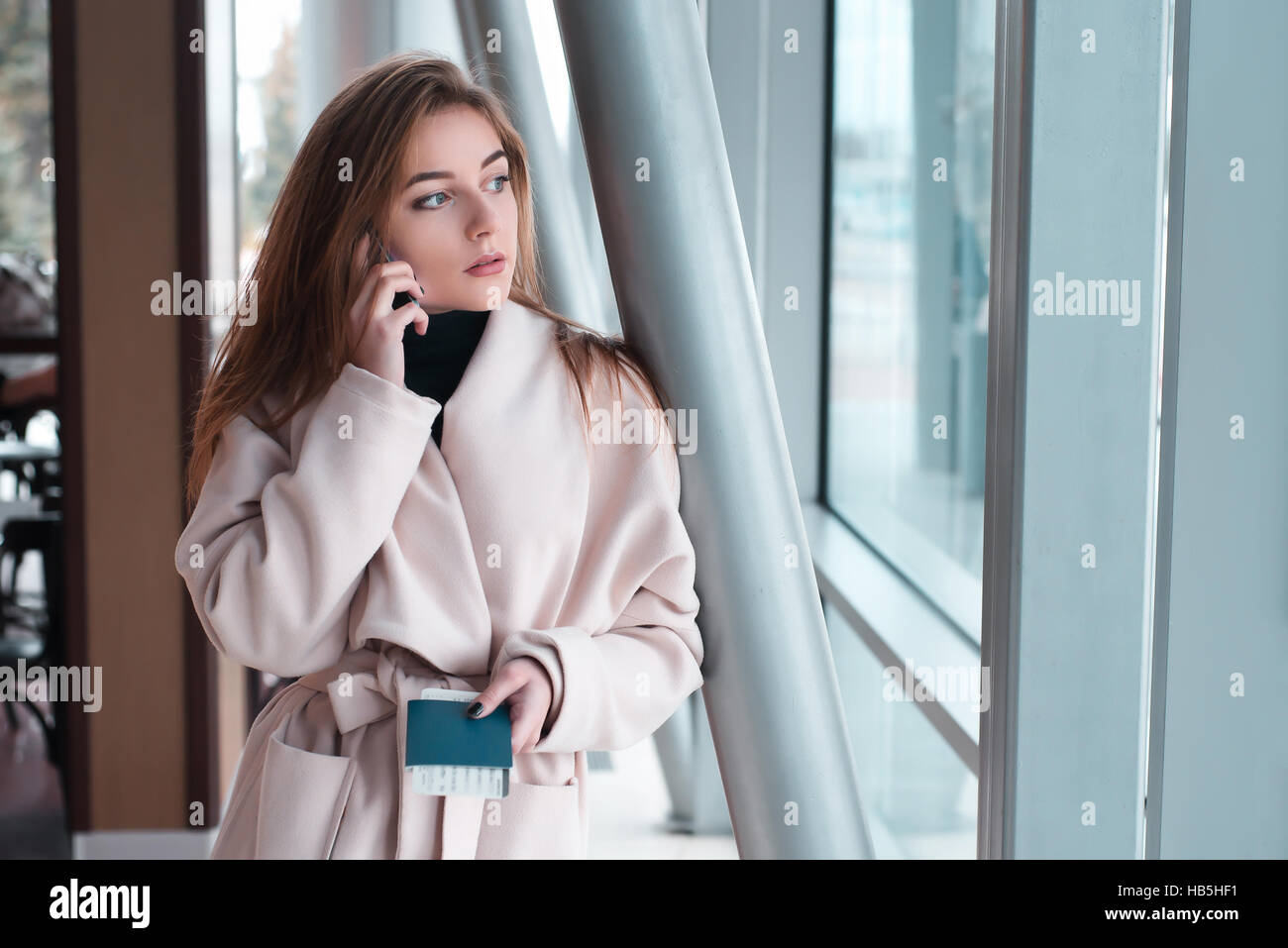 Young woman in international airport Stock Photo - Alamy