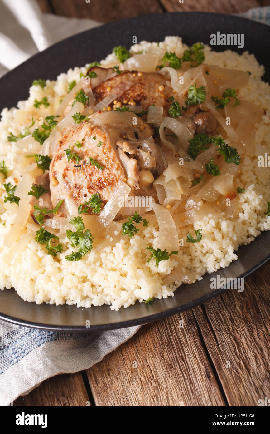 Traditional Senegalese cuisine Chicken Yassa with couscous and onions