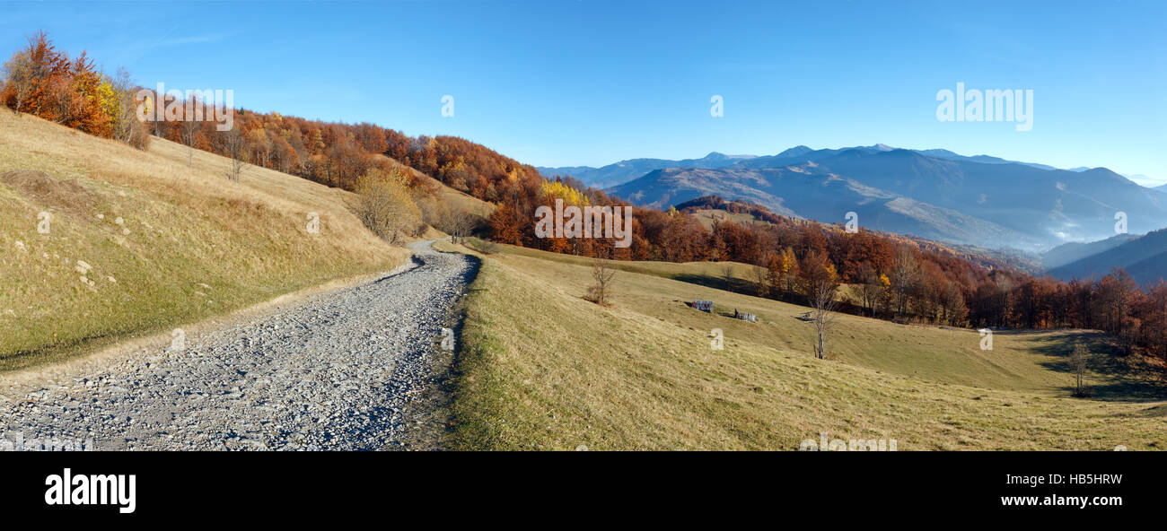 Rural road and autumn mountain landscape Stock Photo - Alamy