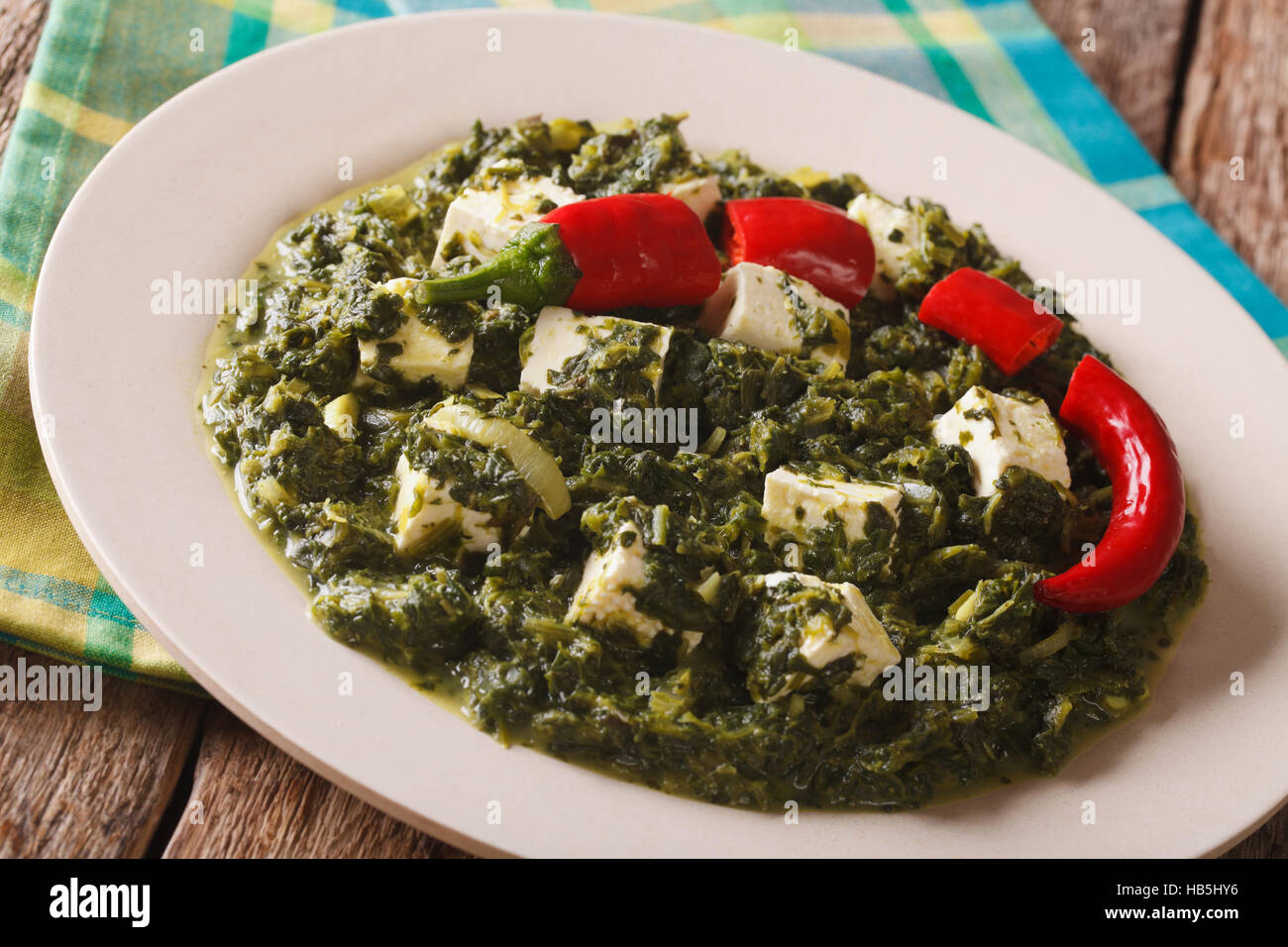 Indian Food Palak paneer spinach with cheese and pepper closeup on a
