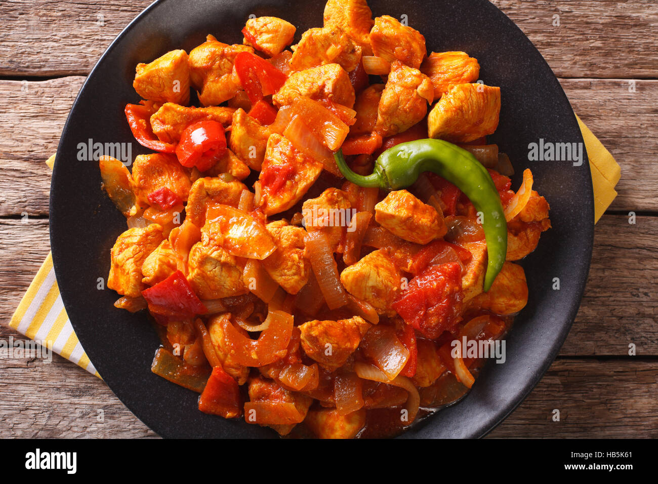 https://c8.alamy.com/comp/HB5K61/spicy-chicken-jalfrezi-with-pepper-and-onion-close-up-on-a-plate-horizontal-HB5K61.jpg