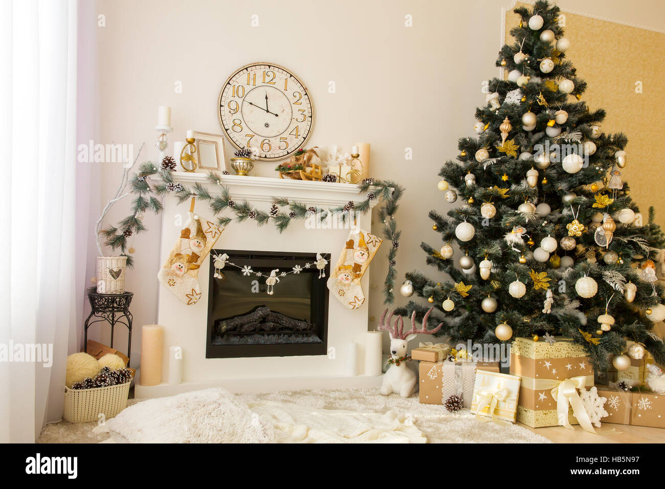 Christmas interior with fireplace and xmas tree. Stock Photo