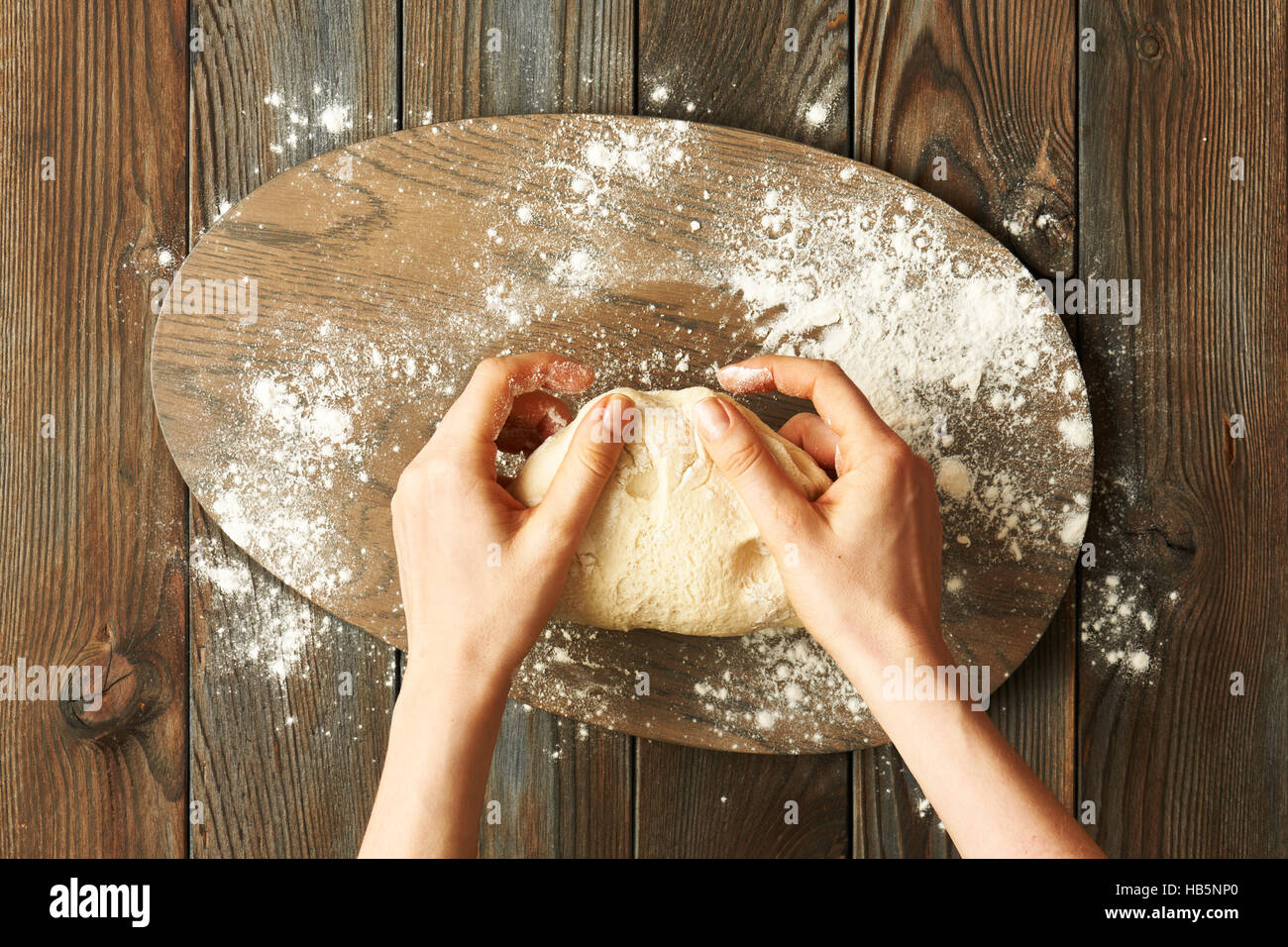 Female hands kneading dough Stock Photo - Alamy