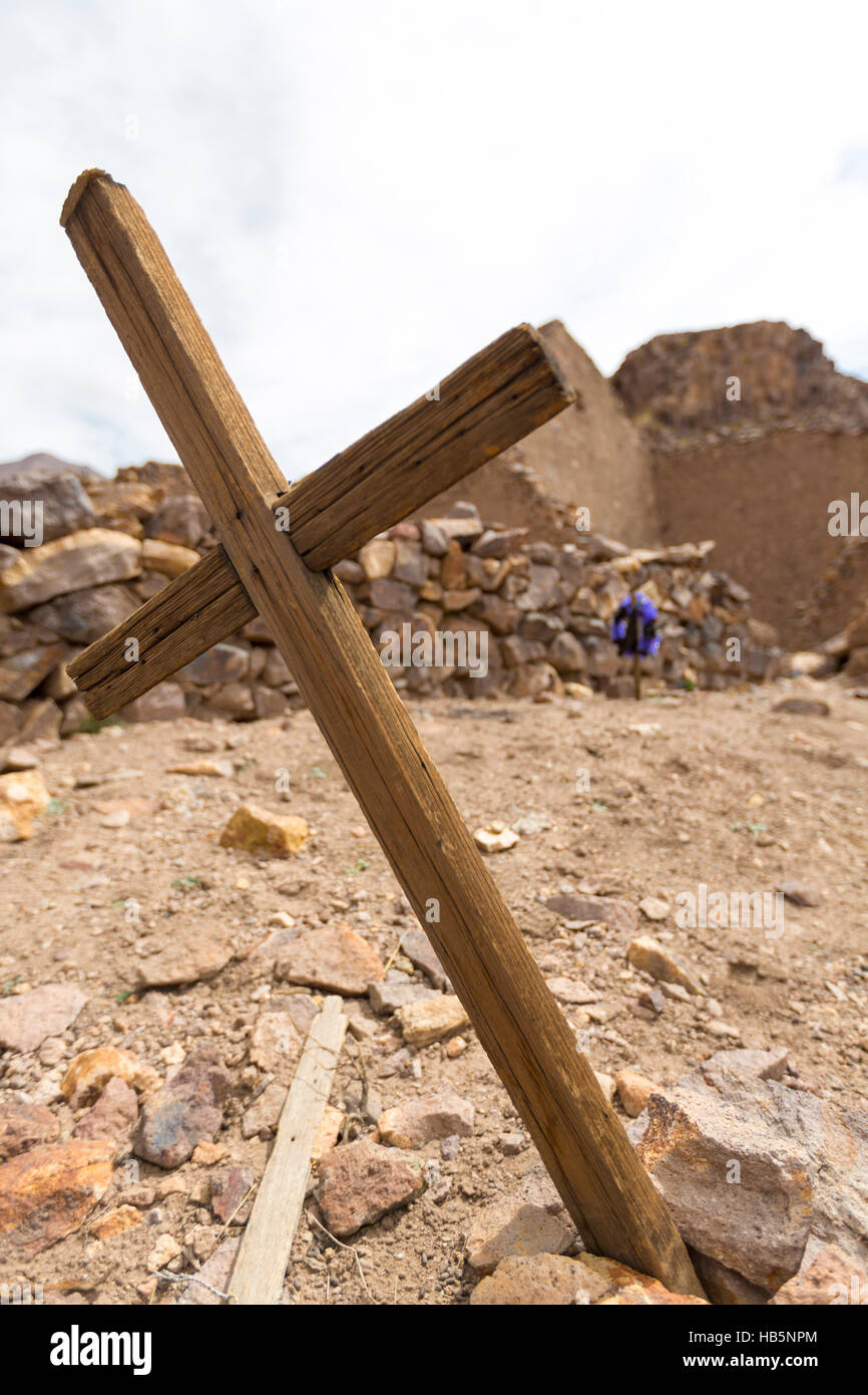 Wooden old christian religious cross at the Lipez ruins in Bolivia Stock Photo