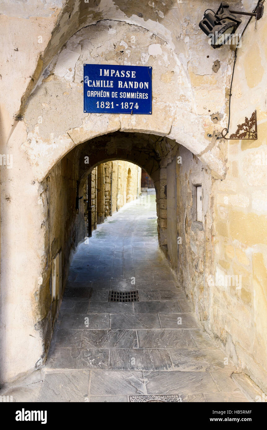 Narrow arch passage in the medieval town of Sommières, Gard, France Stock Photo