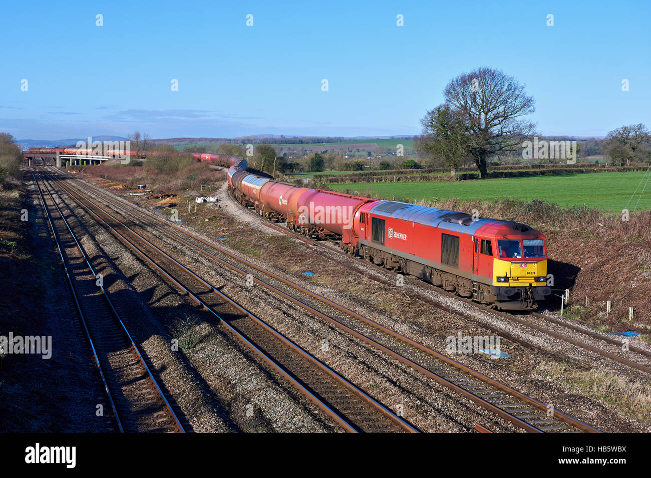 DBS 60074 heads over the Bishton Flyover working the 6B13 Robeston to Westerleigh loaded murco bogie tanks on 18th Feb 2016. Stock Photo