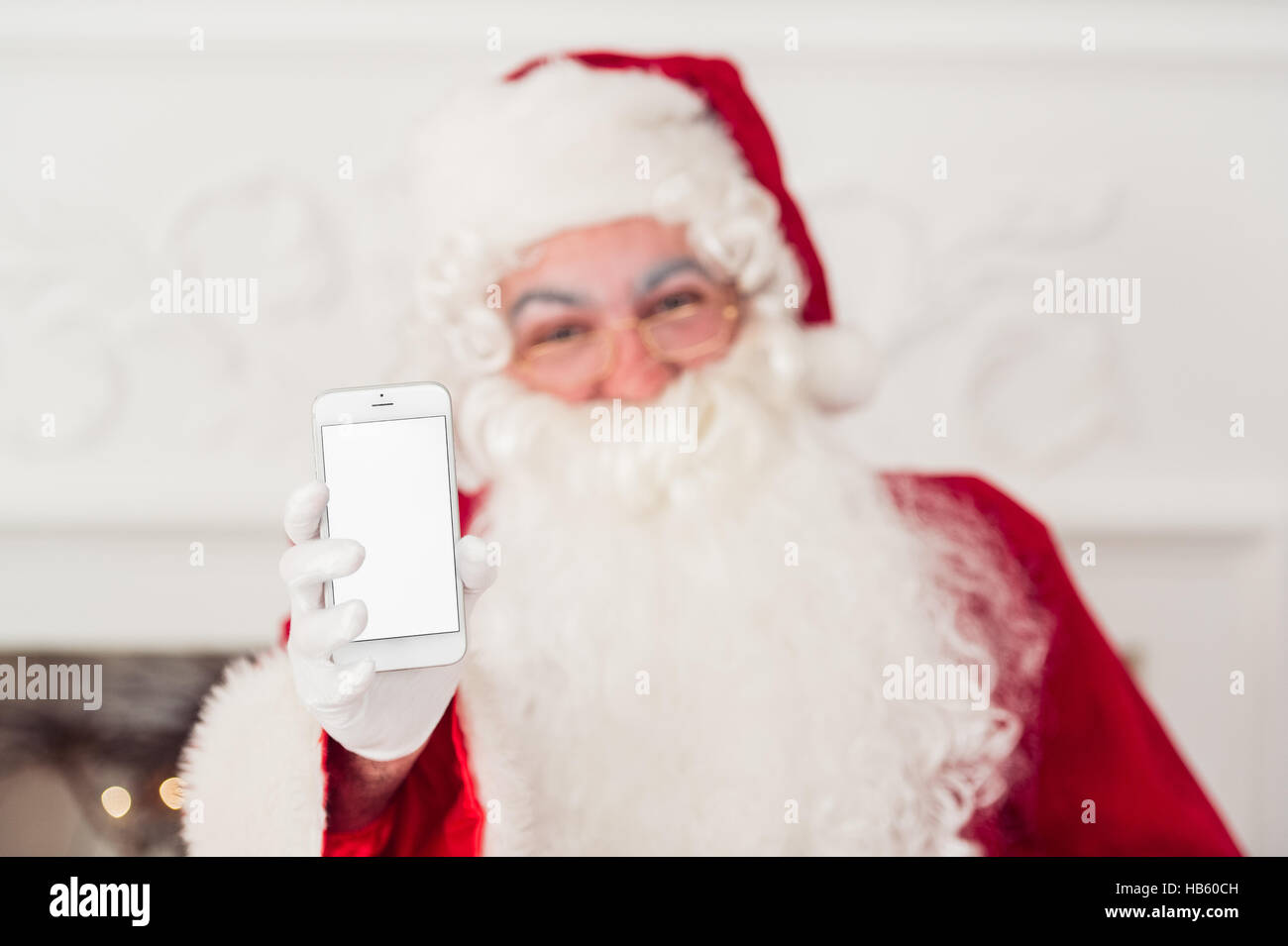 santa claus shows blank screen on a smart phone display Stock Photo - Alamy