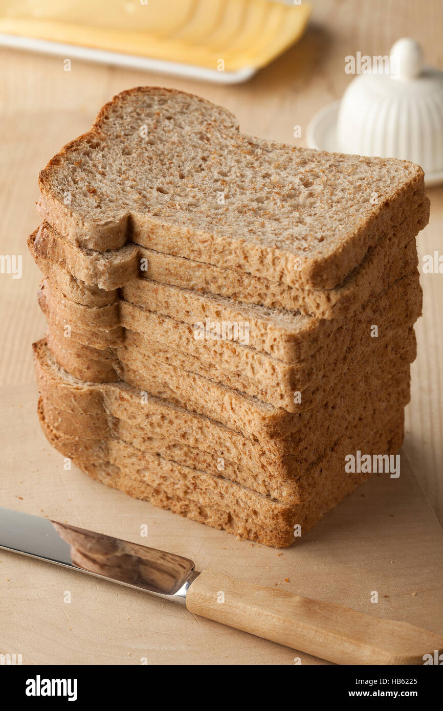 Pile of fresh slices of brown bread Stock Photo