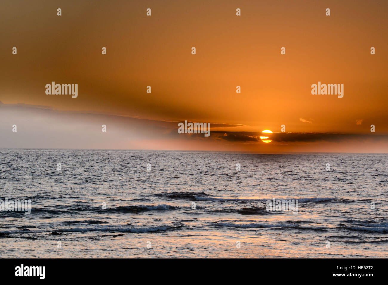 Sea Setting Example The Sun Setting in the Sea Stock Photo - Alamy