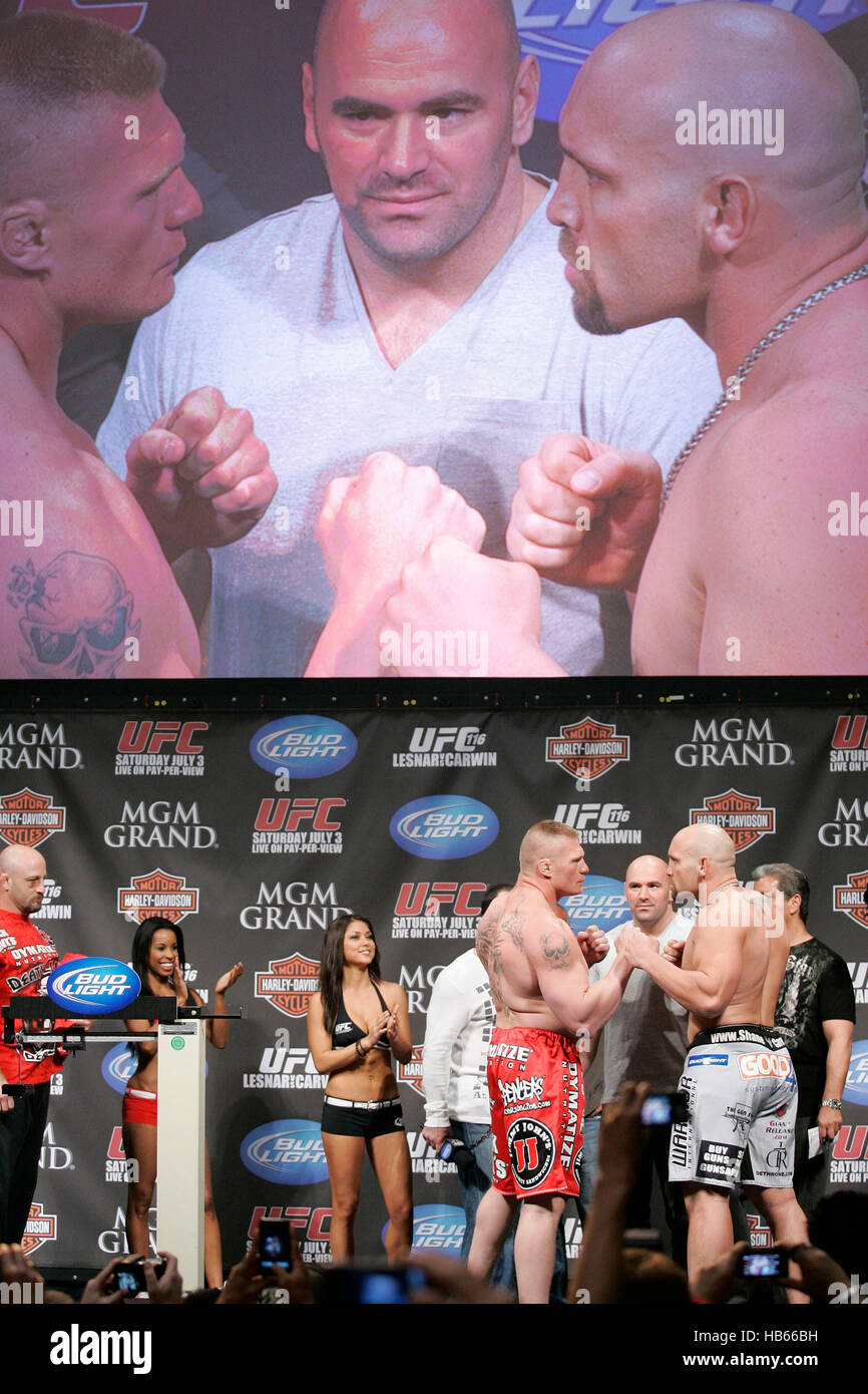 UFC fighter Brock Lesnar, left, squares off with Shane Carwin, right