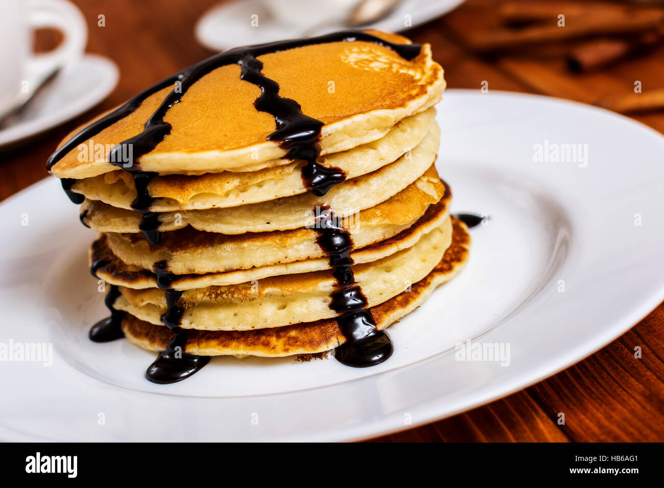 Traditional american breakfast pancakes with maple syrup and chocolate Stock Photo