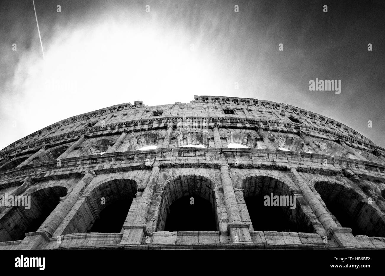 The Colusseum Stands Against The Dark Rome Sky Stock Photo