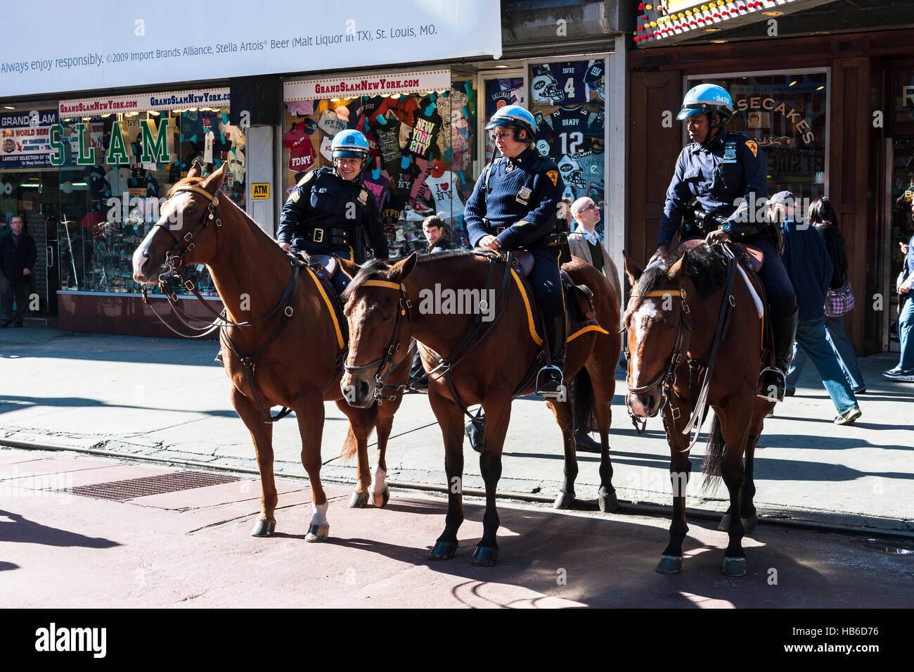 Three female police officers on horses patrol Times Square in Manhattan, New York City, during the day Stock Photo