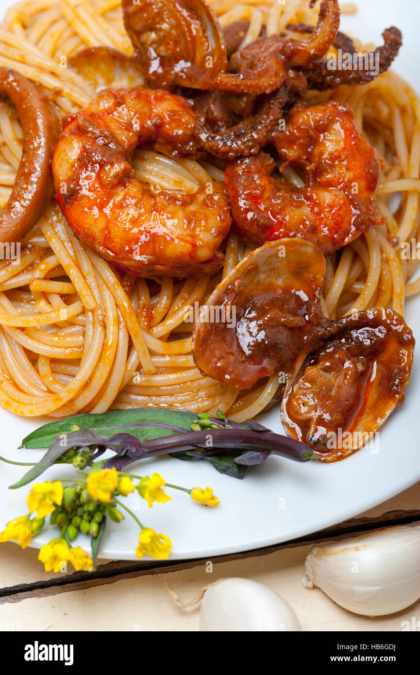 Italian seafood spaghetti pasta on red tomato sauce Stock Photo - Alamy