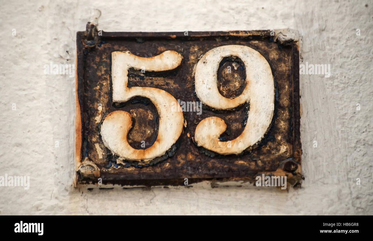 Old retro cast iron plate number 59 Stock Photo Alamy