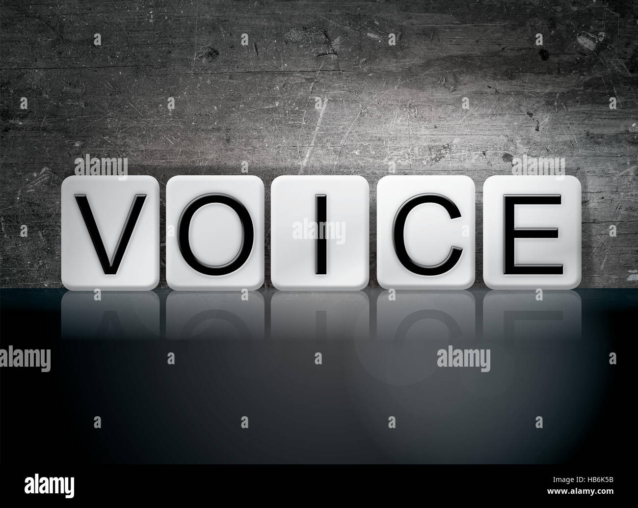 The word "Voice" written in white tiles against a dark vintage grunge background. Stock Photo