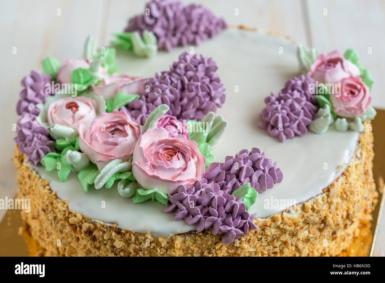 Wedding cake with spring flowers. Stock Photo