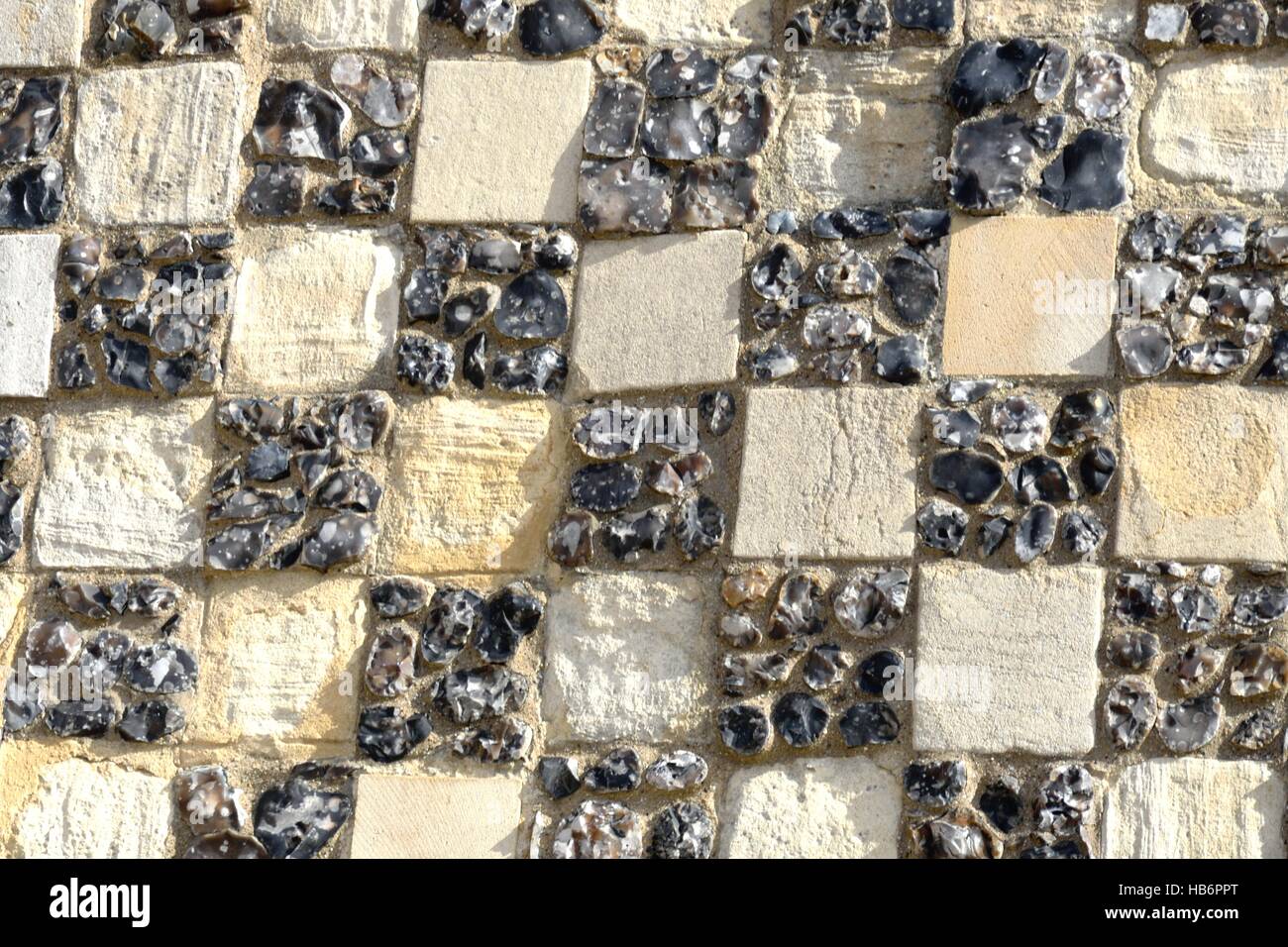 Chequerd stone detail on ancient building Stock Photo - Alamy