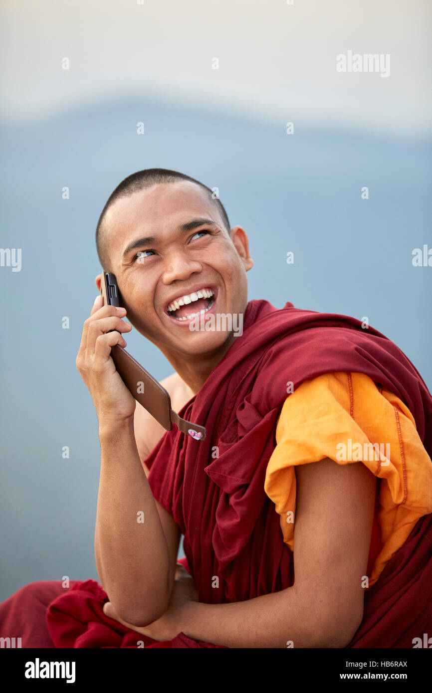 Monk on a cellular phone, Myanmar Stock Photo