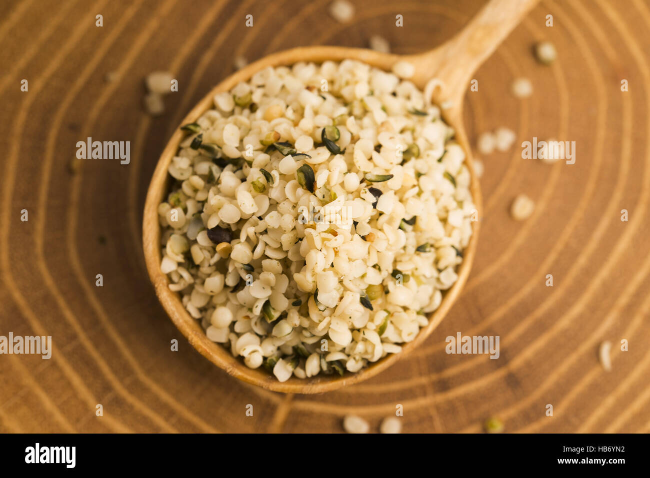Shelled hemp seeds on wood background Stock Photo - Alamy