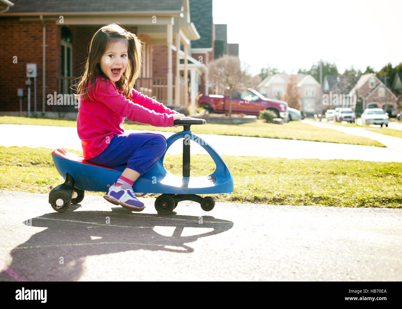 girl riding scooter Stock Photo