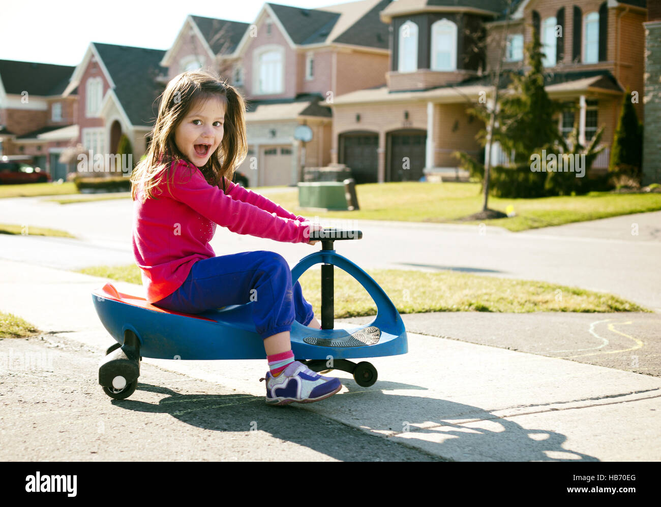 girl riding scooter Stock Photo