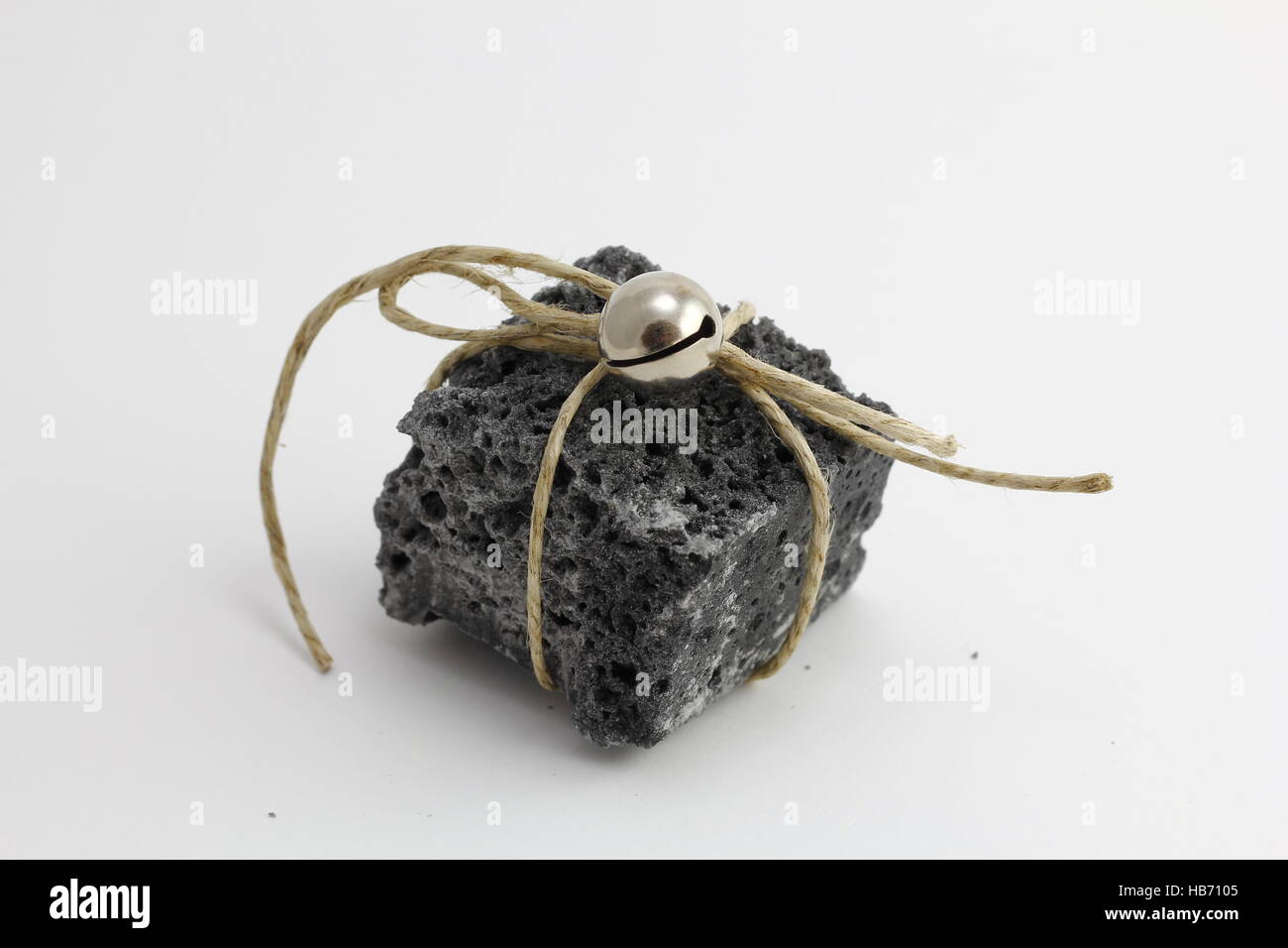 Christmas coal with white ribbon, sweet gift for naughty boys Stock Photo