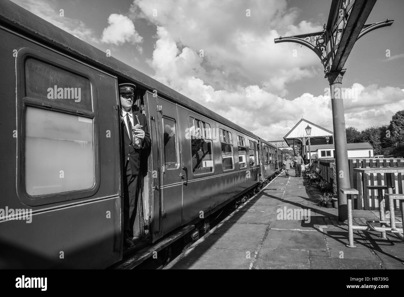 conductor at the train with sandwich  Ray Boswell Stock Photo