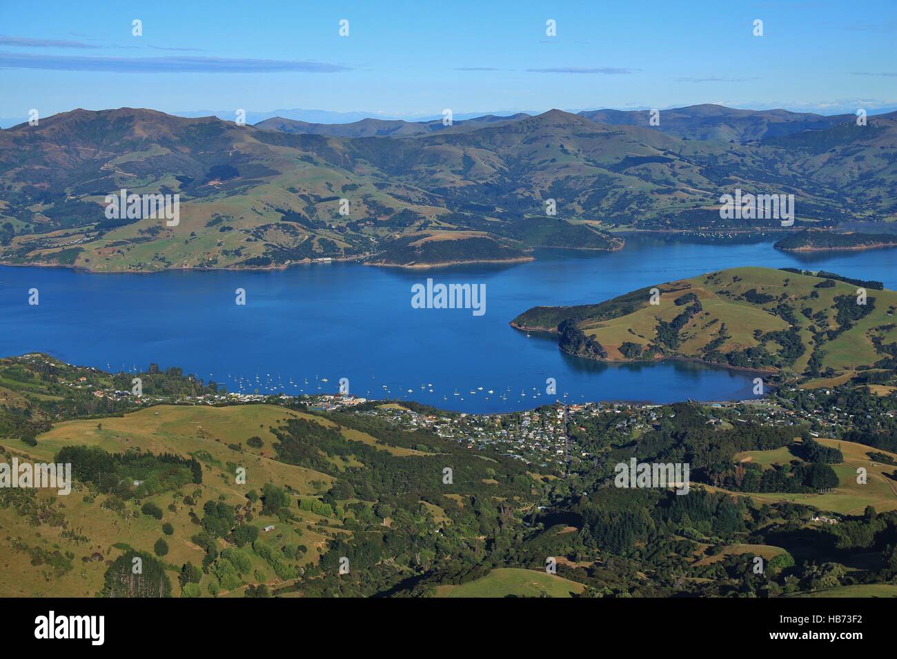 Distant view of Akaroa and Akaroa Harbour Stock Photo Alamy