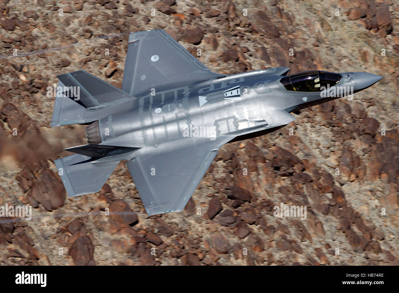 Lockheed Martin F-35A Lighting II from the 323 Squadron, Royal Netherlands Air Force, flies low level through the Jedi Transition, Star Wars Canyon, Death Valley National Park, California, United States of America Stock Photo