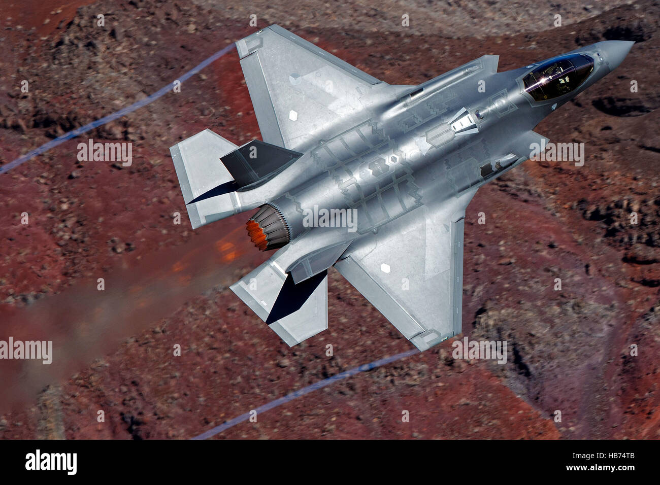 Lockheed Martin F-35A Lighting II from the 323 Squadron, Royal Netherlands Air Force, flies low level through the Jedi Transition, Star Wars Canyon, Death Valley National Park, California, United States of America Stock Photo