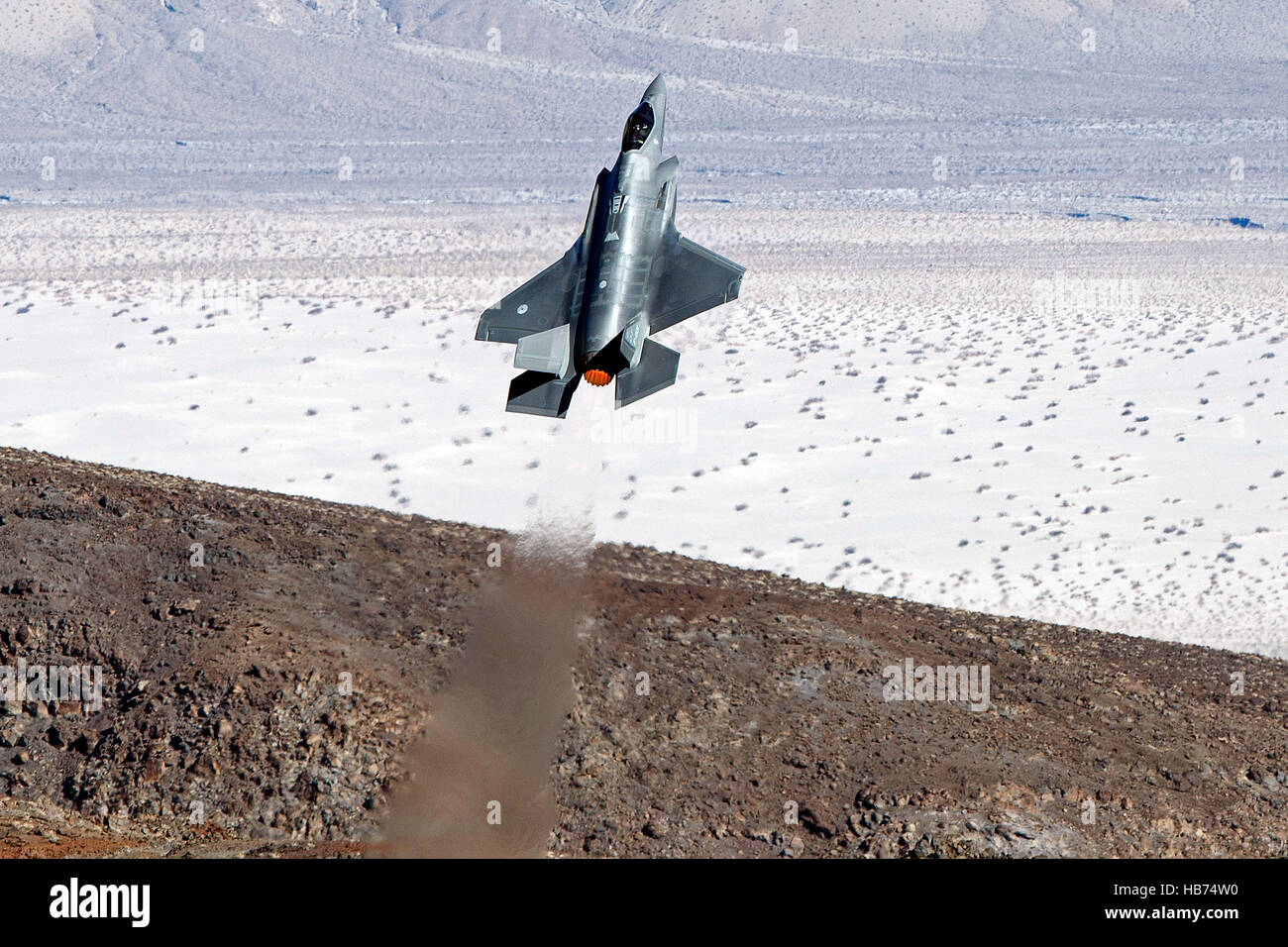 Lockheed Martin F-35A Lighting II from the 323 Squadron, Royal Netherlands Air Force, flies low level through the Jedi Transition, Star Wars Canyon, Death Valley National Park, California, United States of America Stock Photo