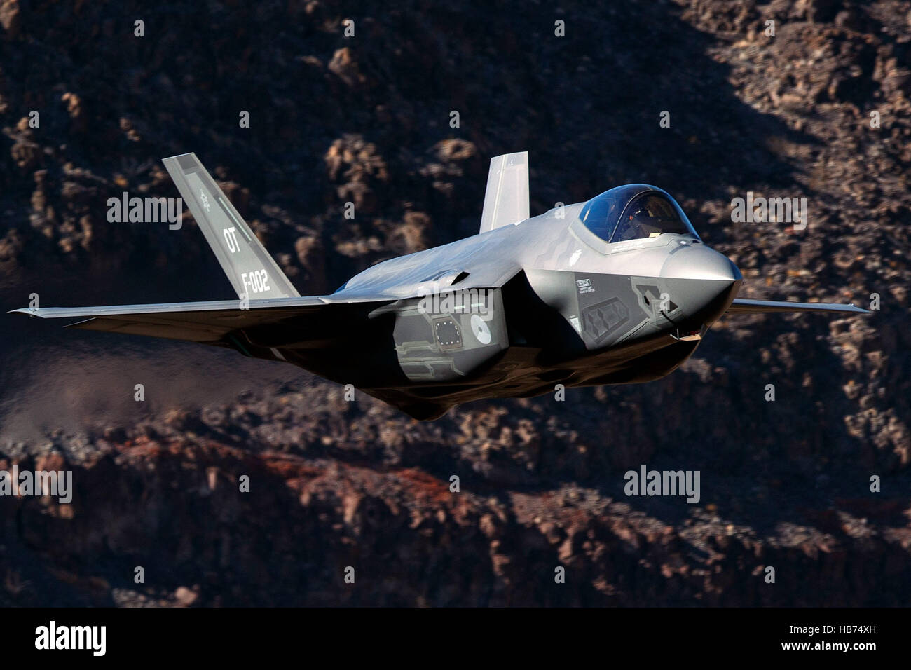Lockheed Martin F-35A Lighting II from the 323 Squadron, Royal Netherlands Air Force, flies low level through the Jedi Transition, Star Wars Canyon, Death Valley National Park, California, United States of America Stock Photo