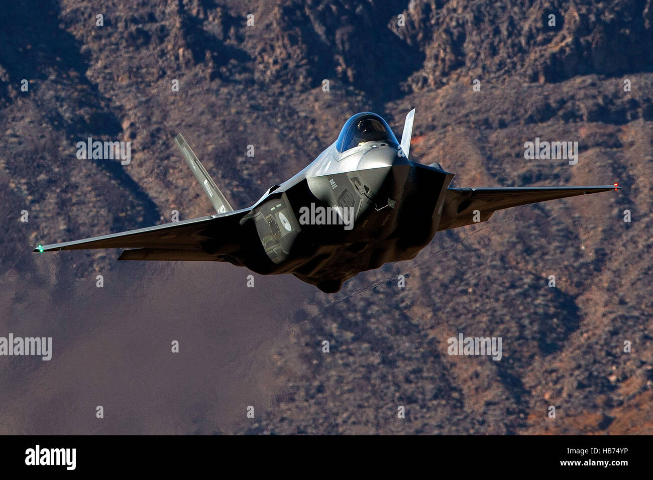 Lockheed Martin F-35A Lighting II from the 323 Squadron, Royal Netherlands Air Force, flies low level through the Jedi Transition, Star Wars Canyon, Death Valley National Park, California, United States of America Stock Photo
