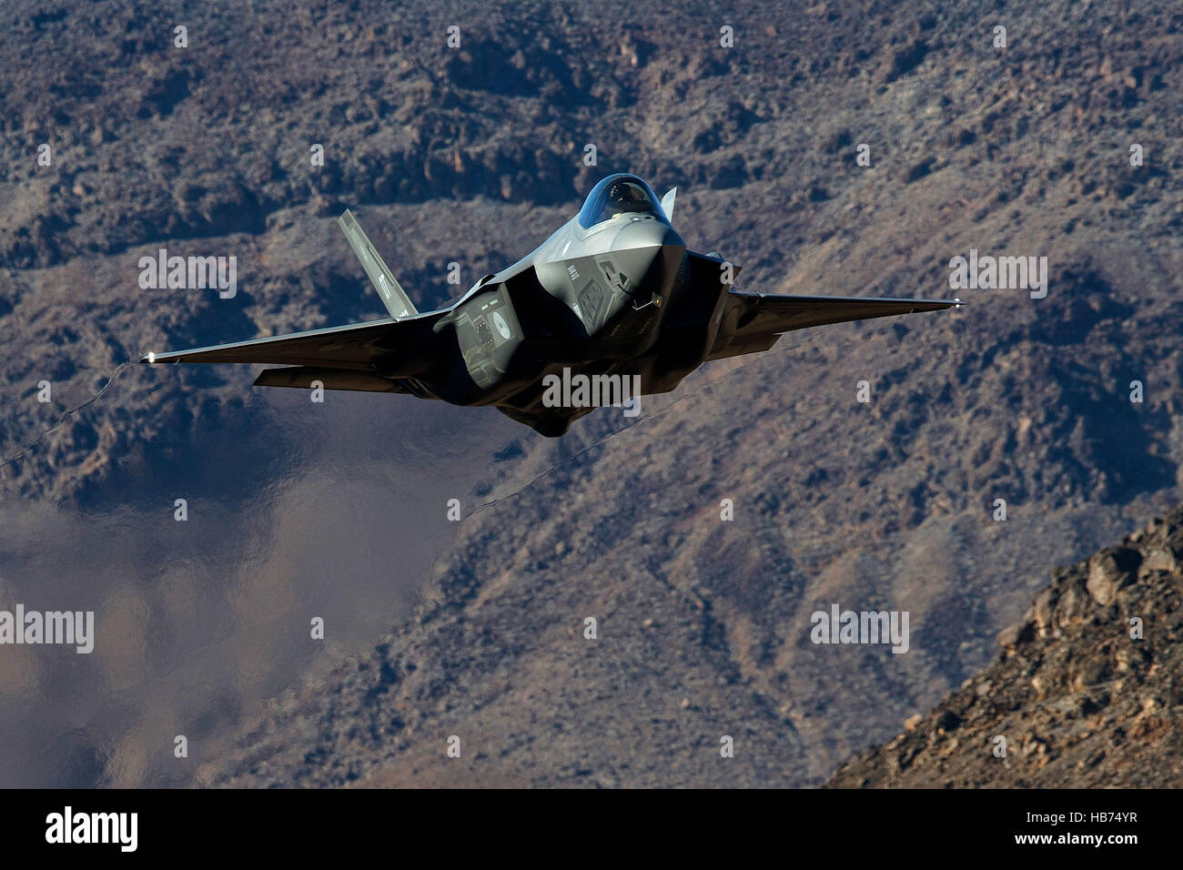 Lockheed Martin F-35A Lighting II from the 323 Squadron, Royal Netherlands Air Force, flies low level through the Jedi Transition, Star Wars Canyon, Death Valley National Park, California, United States of America Stock Photo